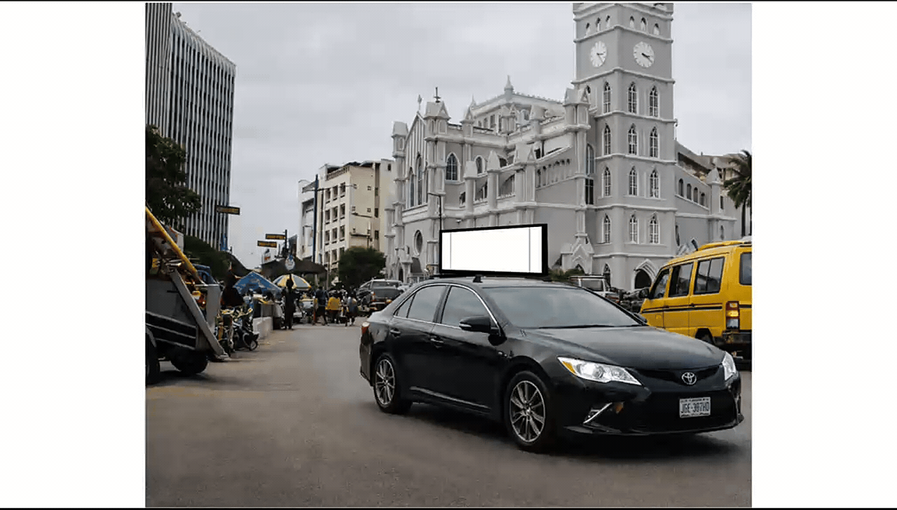 Black SUV carrying a rooftop digital advertising screen